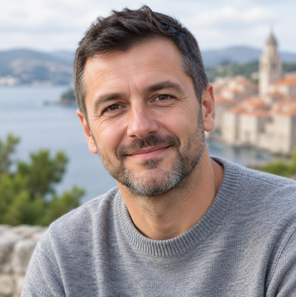 Portrait of a man with short beard outdoors